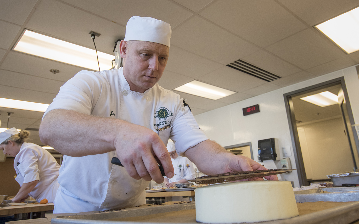 Desserts and Breads student making a cake